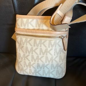 White crossbody Michael Kors bag..